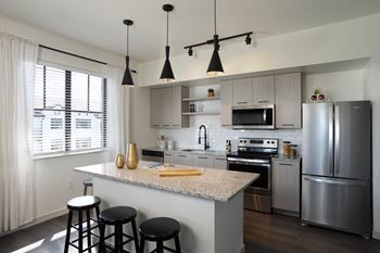 Full kitchen view with stainless steel appliances at Azola West Palm Beach, West Palm Beach, FL, 33411